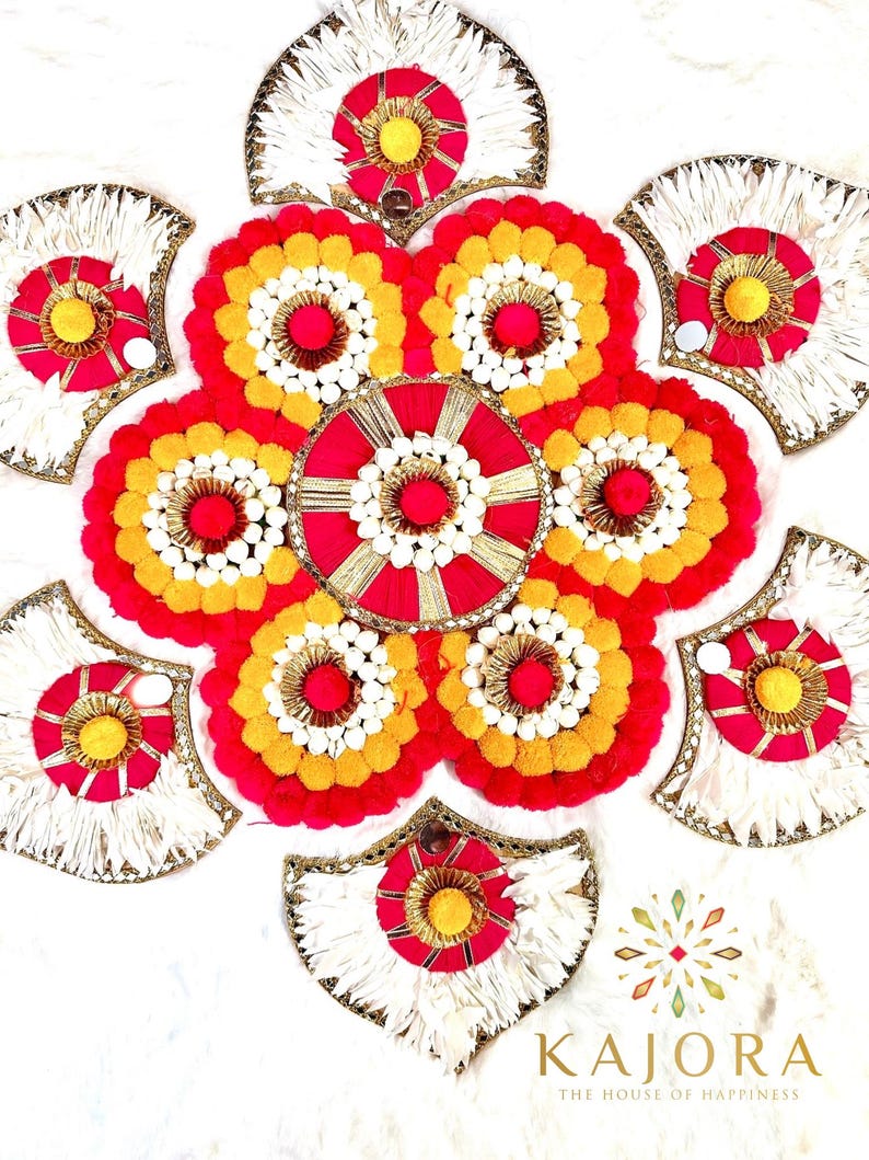 May include: A decorative wall hanging made of white, red, and yellow pom-poms arranged in a circular pattern. The center of the hanging features a red and gold circle with a white pom-pom in the center. The hanging is surrounded by six white, red, and yellow fan-shaped pieces.