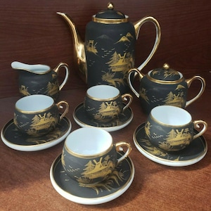 Vintage black and gold Kutani porcelain 13 piece tea set...4 cups, 4 saucers, teapot, teapot lid, creamer, sugar bowl, sugar bowl lid.