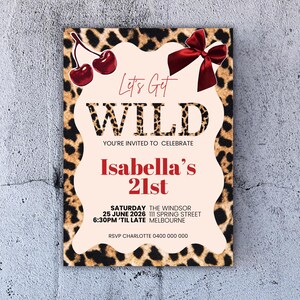 May include: A party invitation with a leopard print border and a light peach center. The text "Let's Get WILD" is displayed, along with "Isabella's 21st" in red. Includes event details and cherry and bow illustrations.