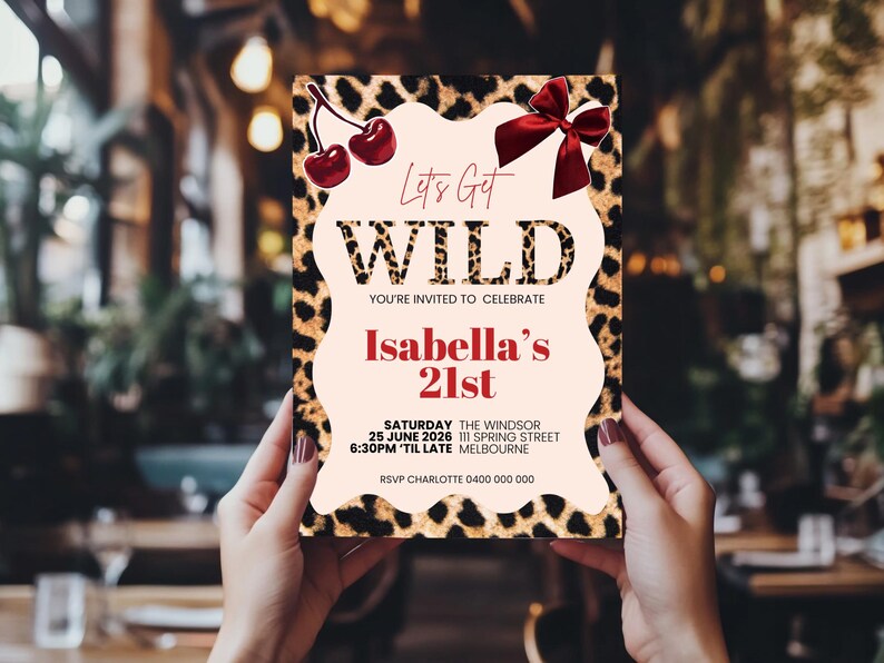 May include: A party invitation with a leopard print border and the words "Let's Get WILD" in a bold font. The invitation includes the text "Isabella's 21st" and event details. Decorative cherries and a red bow adorn the top.