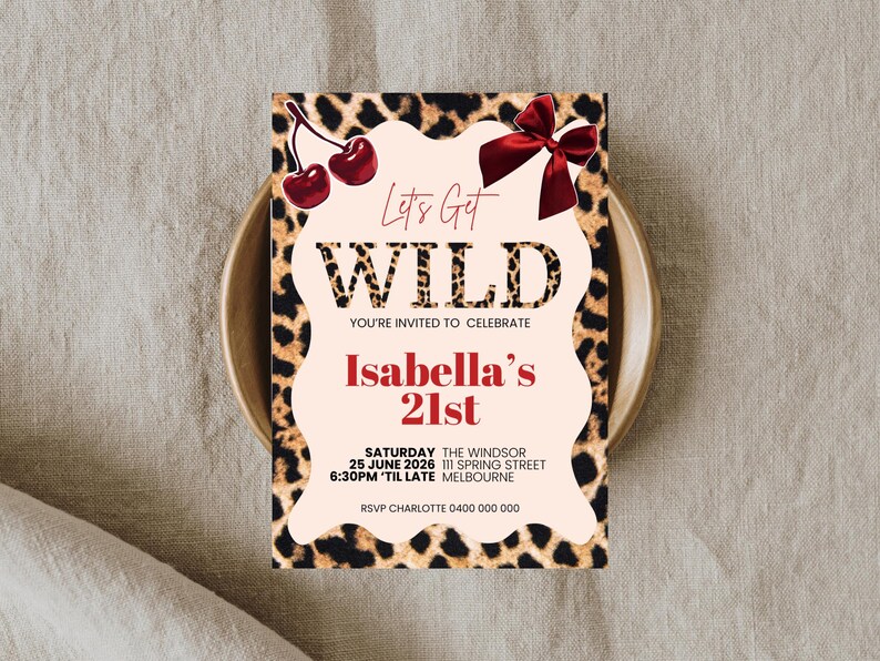 May include: A party invitation with a leopard print border and a light pink center. The text "Let's Get WILD" is at the top, with "Isabella's 21st" in red. Includes event details: date, time, location, and RSVP information.