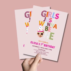 May include: A light pink birthday invitation card featuring the colorful text GIRLS JUST WANNA BE ONE with a photo of a baby wearing a party hat and sunglasses. The card includes details for Olivia's 1st birthday on Saturday, June 20th at 7 PM.