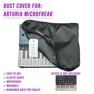 May include: A black dust cover for the Arturia Microfreak synthesizer. The cover has elastic edges and a narrowed back for cables. The text "Dustcover for Arturia Microfreak" is printed on a white label attached to the cover.
