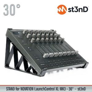 May include: A black Novation LaunchControl XL MK3 controller on a black stand, angled at 30 degrees. The controller features numerous knobs, faders, and buttons. The st3nD logo is visible in the upper right corner. The stand is designed to elevate the controller.