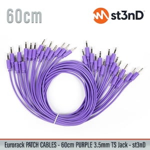 May include: A bundle of purple 60cm (23.6 inches) Eurorack patch cables with 3.5mm TS jacks. The cables are a vibrant purple color, with silver connectors. The st3nD logo is visible in the upper right corner. The cables are neatly arranged.