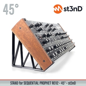 May include: A wooden stand with a black metal frame, designed to hold a Sequential Prophet Rev2 synthesizer at a 45-degree angle. The stand is labeled "st3nD" and "STAND for SEQUENTIAL PROPHET REV2 - 45° - st3nD".