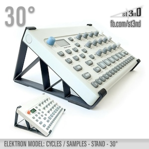 May include: A black stand with a 30-degree angle, designed to hold a white Elektron Cycles or Samples synthesizer. The stand is made of sturdy plastic and provides a stable platform for the synthesizer. The stand is shown with the synthesizer in place, tilted at a 30-degree angle.