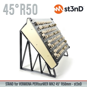 May include: A black metal stand for a Vermona Perfourmer MK2 45° R50mm synthesizer. The stand is angled at 45 degrees and has a black metal frame. The synthesizer is beige and has a grid of knobs and buttons.