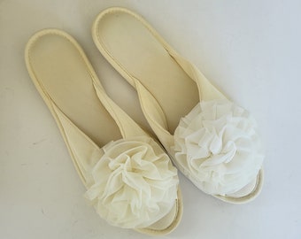 Old fashioned slippers with shop pom poms