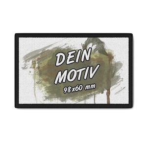 May include: Rectangular patch with a black border. The patch features the words "DEIN MOTIV" in white, over a camouflage-style background. The dimensions are 98x60 mm.