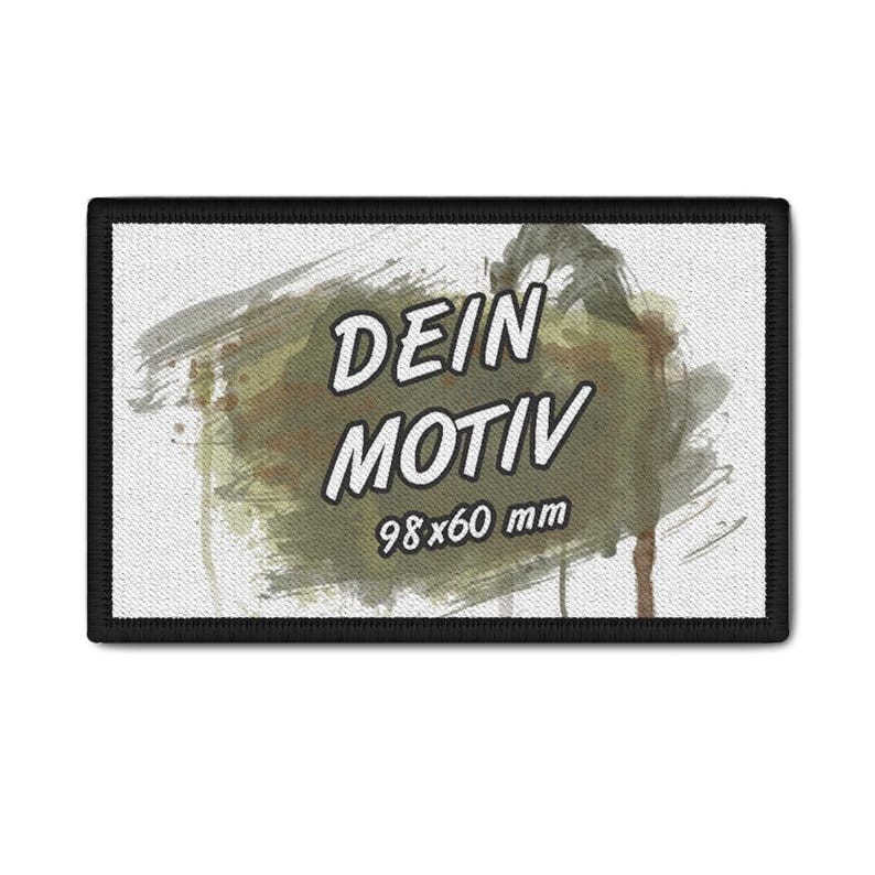 May include: Rectangular patch with a black border. The patch features the words "DEIN MOTIV" in white, over a camouflage-style background. The dimensions are 9.8 x 6.0 cm.