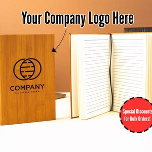 May include: A brown bamboo notebook with a black company logo and the text "COMPANY SLOGAN HERE". The notebook is open to reveal lined pages. The text "Special Discounts for Bulk Orders!" is in a red circle.