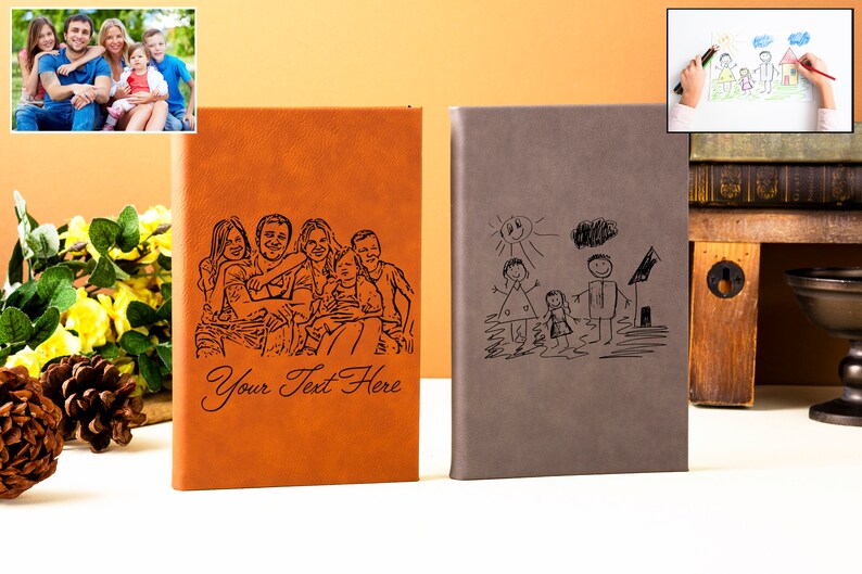May include: Two brown leather journals with personalized engravings. One journal features a black and white photo of a family, the other features a black and white drawing of a family. The text "Your Text Here" is engraved on the journal with the photo.