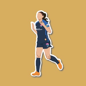 May include: A female soccer player wearing a blue jersey with white and pink accents, running with her arms raised. The jersey has the text "OL Reign" and "Forward Together" on it.