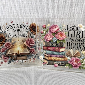 May include: Two clear acrylic decorations with a book theme. One features sunflowers, roses, and an open book with the text "Just a girl who loves books." The other has a stack of books and flowers with the same text.