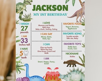 May include: A personalized birthday sign for a child named Jackson, featuring dinosaur illustrations and milestone details. The sign indicates Jackson weighs 27 pounds and is 33 inches tall. It includes favorite things, such as food, toys, and song.
