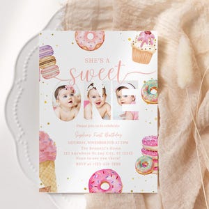 May include: A pink and white first birthday invitation with a donut theme. The invitation features a photo of a baby girl in the center, surrounded by donuts, cupcakes, and macarons. The text on the invitation reads "She's a sweet one" and includes the date, time, and location of the party.