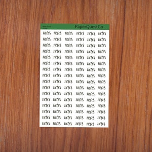 May include: A sheet of white sticker paper with the word "notes" repeated in cursive handwriting. The sheet is on a woodgrain background. The text "PaperQuestCo" is printed in green at the top of the sheet.