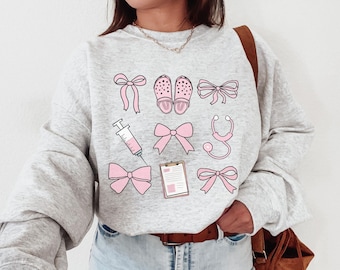Coquette Nurse Shirt, Pink Bow Nurse Sweatshirt, Girlcore Nurse Sweater, Softcore Nurse Graduation, Girly Nurse Birthday Gift, New Nurse Tee