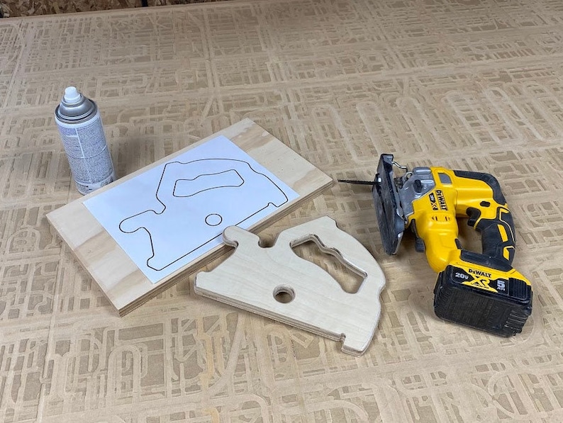 Downloadable PDF file for printing to legal size printer paper to cut out of wood a push stick in the shape of a circular saw for using on a table saw.