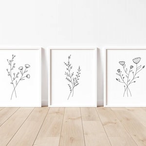 Discover the beauty of simplicity with this Set of 3 Minimal Floral Prints. These Flower Line Art Prints make for a captivating addition to any Flower Wall Art display, bringing nature indoors