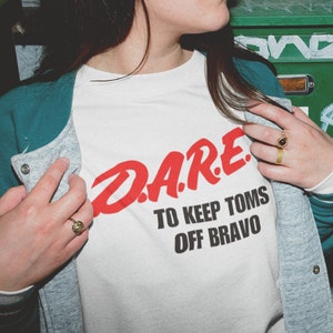 Real Housewives & Vanderpump Rules "Dare to Keep Toms Off Bravo" Printed Tee