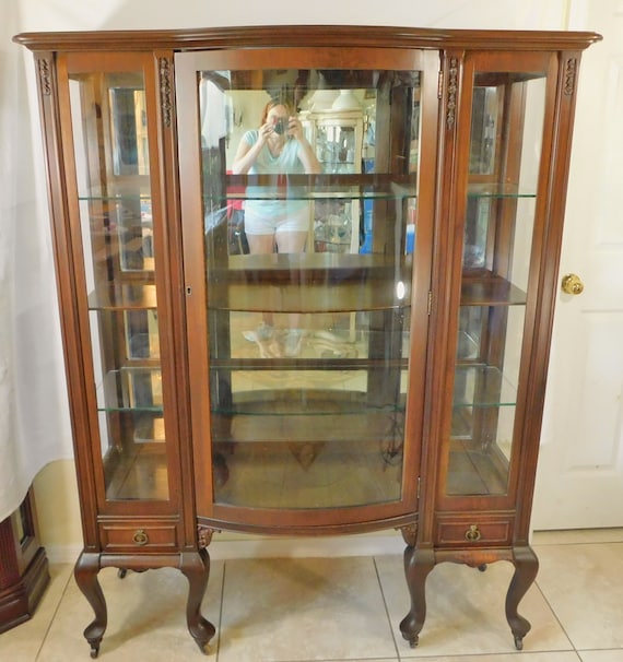 Antique bow front curio cabinet discount