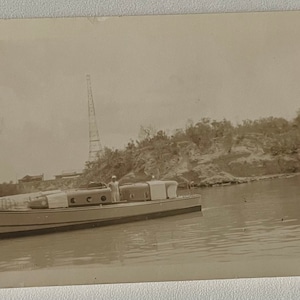 Photo of man on boat, possibly military. 15 printed on back
