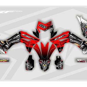 May include: A graphic design for a motorcycle, featuring a bold red and black color scheme with white accents. The design includes the number "002" and the text "CRF 50". The overall theme is a racing or motorsport aesthetic.