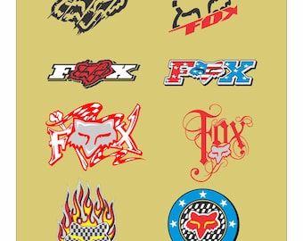 May include: A selection of Fox Racing logos in diverse styles. The logos showcase the fox head in red, black, and white, with some including flames, stars, and the words "Racing" and "Fox". The logos are displayed on a tan background.