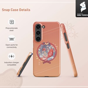 May include: A pink and orange phone case with a Japanese-inspired design featuring a fish, flowers, and a red circle. The case is made of polycarbonate and has open ports for connectivity. It is also compatible with induction chargers.