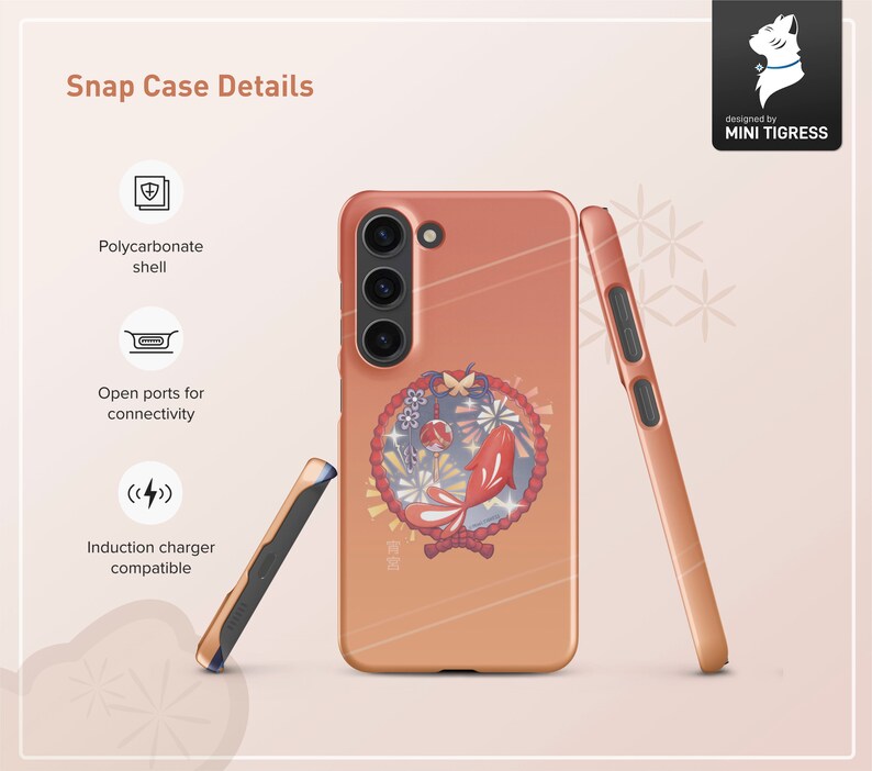 May include: A pink and orange phone case with a Japanese-inspired design featuring a fish, flowers, and a red circle. The case is made of polycarbonate and has open ports for connectivity. It is also compatible with induction chargers.