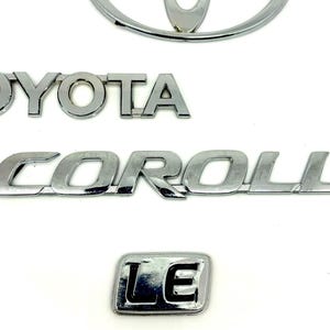 Toyota Corolla LE Emblem set of 4 Piece Hand Made Die Cast