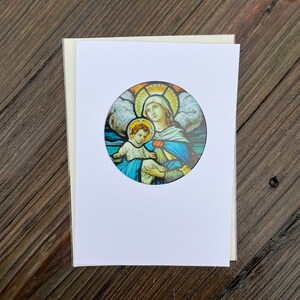 Tarjeta navideña con atrapasol de la Virgen y el Niño