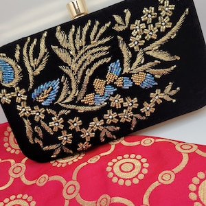 Hand embroidered clutch