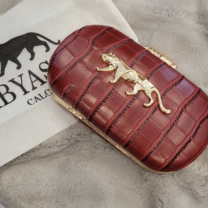 Sabyasachi velvet clutch hotsell