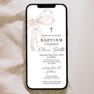 May include: A white and gold bow with pearls hangs from the top of a white and black digital invitation. The invitation reads "Please join us for the Baptism of our daughter Olivia Smith, Saturday April 24th, 2024 at 1:00pm, St. Michael's Church, 123 White Street, Seattle, WA 12548, celebration to follow, The Round Barn, Lexington, Kentucky, RSVP by April 15th 2024 to Mary 123-456-78-90".