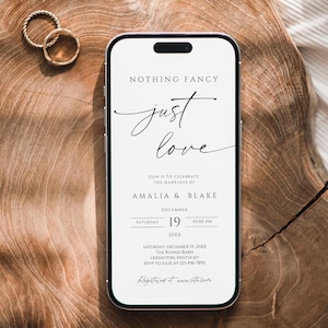 May include: A white smartphone mockup displaying a wedding invitation with the text "Nothing Fancy, Just Love" and the names "Amalia & Blake". The invitation includes the date, time, and location of the wedding.