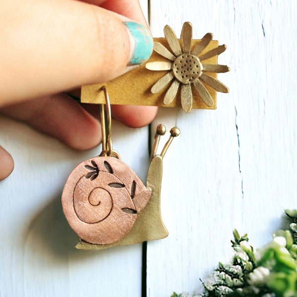 Snail and daisy earrings, asymmetric brass and copper earrings, different earrings, commissioned earrings. Snail earrings.