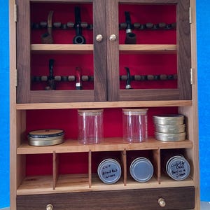 22 pipe and tobacco cabinet.