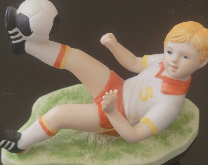 80s Enesco Figurine Boy Kicking a Soccer Ball #5 on his Shirt dated 1984