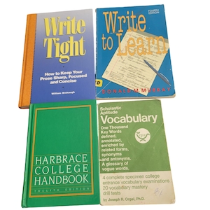 May include: Four different books stacked on top of each other. The top book is green and has the title "Scholastic Aptitude Vocabulary" with the text "One Thousand Key Words defined, annotated, enriched by related forms, synonyms and antonyms. A glossary of vogue words." The second book is blue and has the title "Write to Learn" with the text "Fourth Edition" and the author "Donald M. Murray". The third book is orange and has the title "Write Tight" with the text "How to Keep Your Prose Sharp, Focused and Concise" and the author "William Brohaugh". The bottom book is green and has the title "Harbrace College Handbook" with the text "Twelfth Edition".