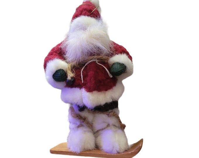 Santa on Snowboard with Packages in sack on Back ornament or stand alone décor.