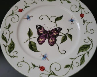 Botanical Gardens Plate Butterfly design in center with Dragonflies and Ladybugs