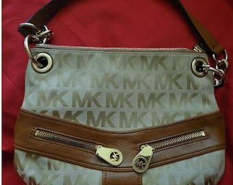 Michael Kors Jamesport Signature Handbag Tab with Leather and Gold Trim Striking