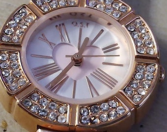 Elegant rose gold O.S.T. watch with a heart cutout dial matching band romanticfn