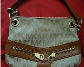 Michael Kors Jamesport Signature Handbag Tab with Leather and Gold Trim Striking