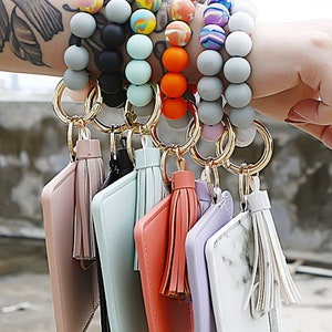 Beurlike Keychain Bracelet with Credit Card Holder for Women Wristlet  Tassel Key Ring ID Wallet for Lady Girls (BlackFlower 2) at  Women's  Clothing store