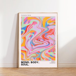 May include: Abstract art print with a swirling pattern of pink, blue, green, yellow, and red. The print has the text "MIND. BODY. SOUL." and "Gallery Exhibition" at the bottom.