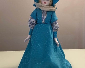 Limited Edition Royal Doulton “Nisbet” heirloom doll with stand, 1983, Henley regatta blue dress